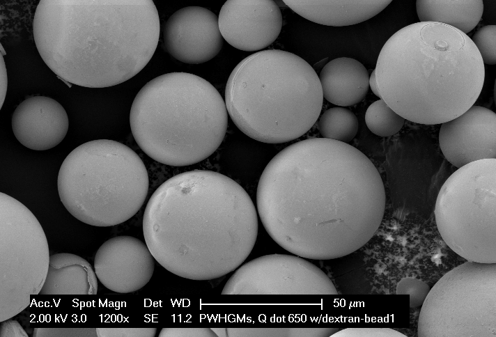 ARC Hitachi SEM showing intact SpheroFill porous-wall hollow glass microspheres; original scale bar retained